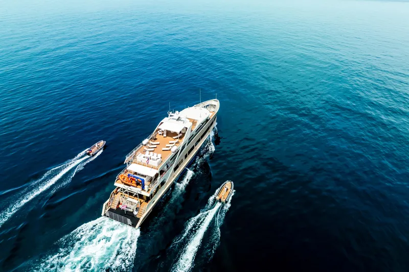 Vanora Yacht Photos Pics Aerial view of 2023 Seacrest Marine 52m Yacht cruising with tenders in open sea.