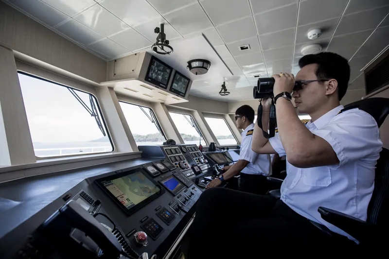 Vanora Yacht Photos Pics Crew navigating Seacrest Marine 52m Yacht, 2023, using advanced control systems.