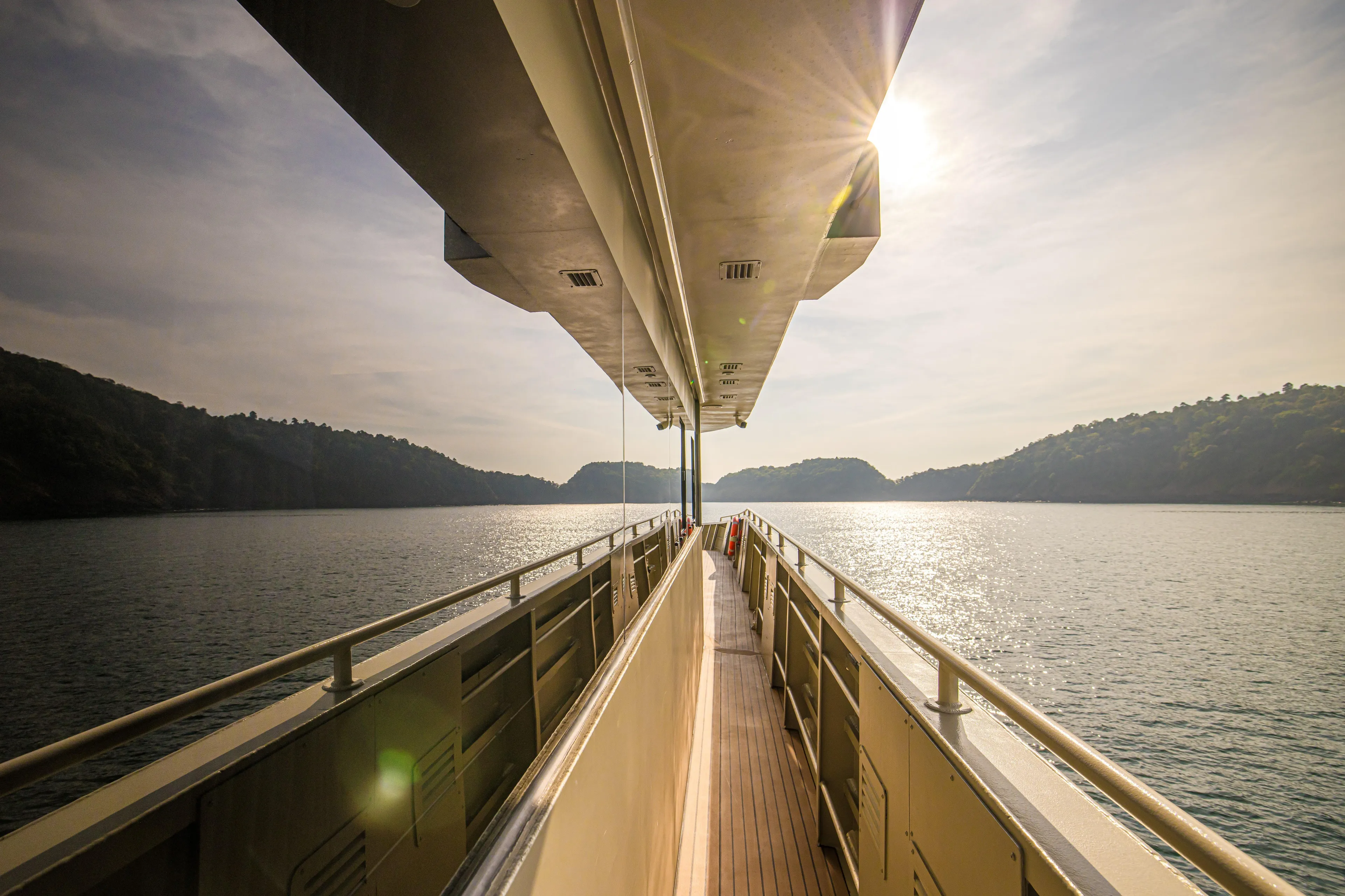 Vanora Yacht Photos Pics Luxurious Seacrest Marine 52m Yacht, 2023 model, cruising on serene waters at sunset.