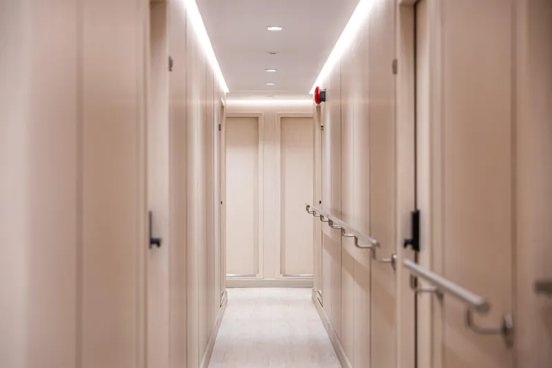 Vanora Yacht Photos Pics Luxurious hallway interior of 2023 Seacrest Marine 52m Yacht, featuring elegant design and lighting.