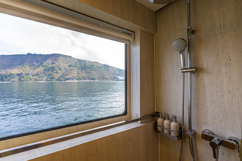 Vanora Yacht Photos Pics Luxurious 2023 Seacrest Marine 52m Yacht bathroom with ocean view window.