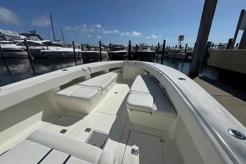  Yacht Photos Pics 2014 SeaVee 340B Open boat docked, featuring spacious seating and sleek design.
