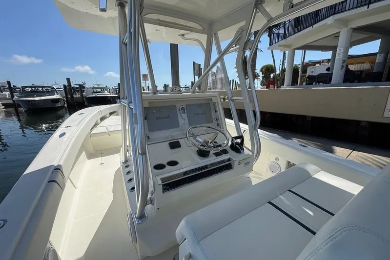  Yacht Photos Pics 2014 SeaVee 340B Open boat interior with helm, docked at marina.