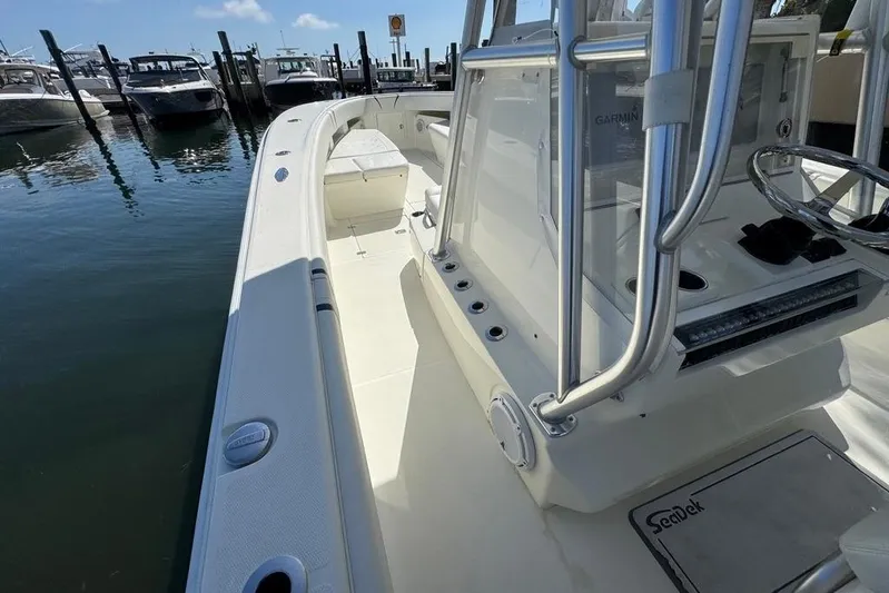  Yacht Photos Pics 2014 SeaVee 340B Open boat docked, featuring spacious deck and modern console.