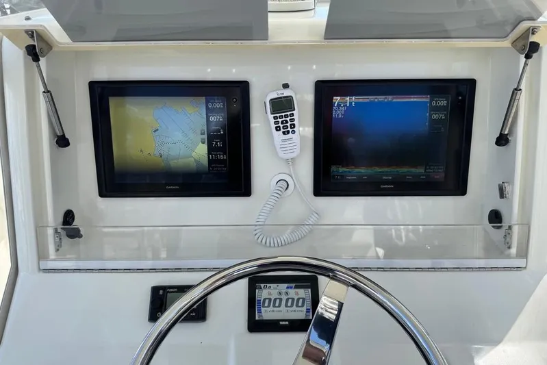  Yacht Photos Pics 2014 SeaVee 340B Open helm with dual Garmin displays and marine radio.
