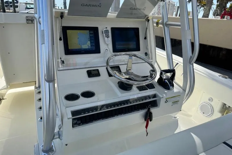  Yacht Photos Pics 2014 SeaVee 340B Open boat console with Garmin navigation displays and steering wheel.