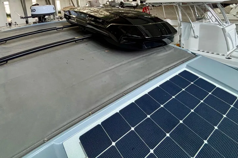  Yacht Photos Pics 2024 Axopar 37 XC Cross Cabin with solar panels and sleek roof design.