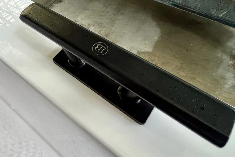  Yacht Photos Pics Close-up of a black handle on a 2024 Axopar 37 XC Cross Cabin boat.