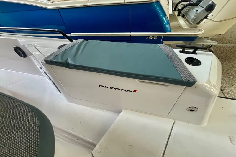  Yacht Photos Pics 2024 Axopar 37 XC Cross Cabin boat seat with storage compartment.