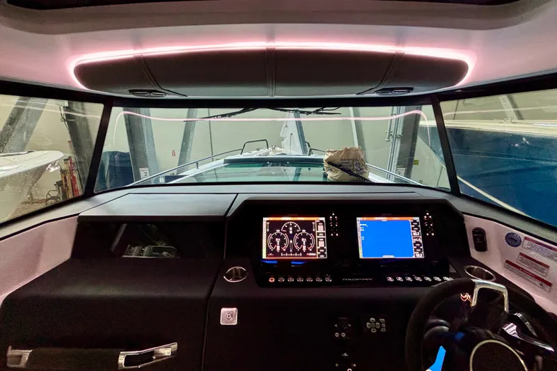  Yacht Photos Pics 2024 Axopar 37 XC Cross Cabin dashboard with modern navigation displays and controls.