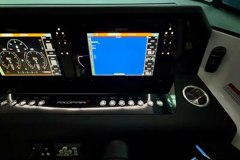  Yacht Photos Pics 2024 Axopar 37 XC Cross Cabin dashboard with dual Simrad displays and control panel.