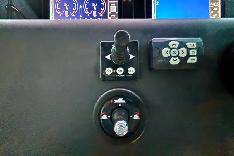  Yacht Photos Pics Control panel of 2024 Axopar 37 XC Cross Cabin with joystick and navigation controls.