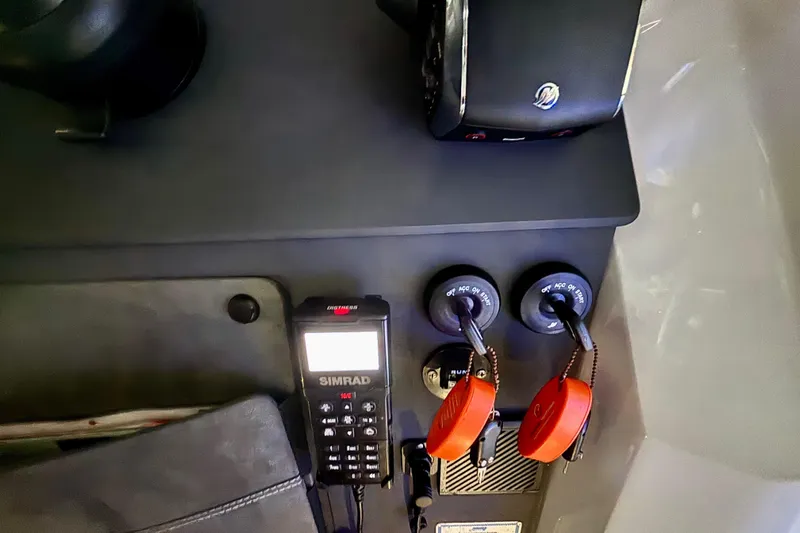  Yacht Photos Pics 2024 Axopar 37 XC Cross Cabin dashboard with Simrad device and ignition keys.