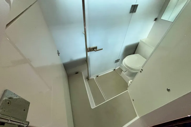  Yacht Photos Pics 2024 Axopar 37 XC Cross Cabin bathroom with shower and toilet.