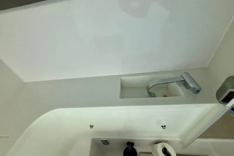  Yacht Photos Pics 2024 Axopar 37 XC Cross Cabin bathroom sink with modern faucet design.