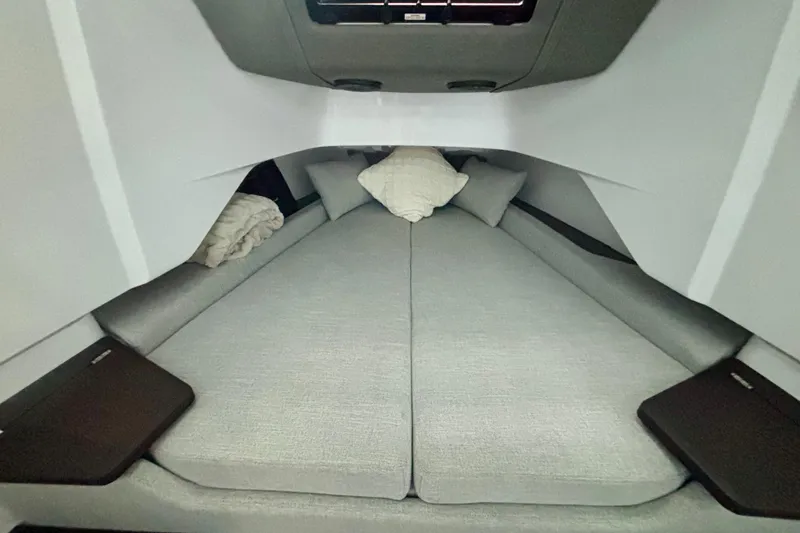  Yacht Photos Pics 2024 Axopar 37 XC Cross Cabin interior with cozy sleeping area and cushions.