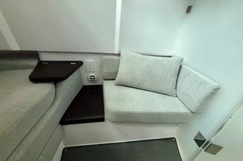  Yacht Photos Pics 2024 Axopar 37 XC Cross Cabin interior with modern seating and sleek design.