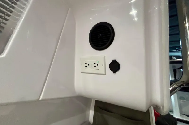  Yacht Photos Pics 2024 Axopar 37 XC Cross Cabin interior with speaker and power outlet.