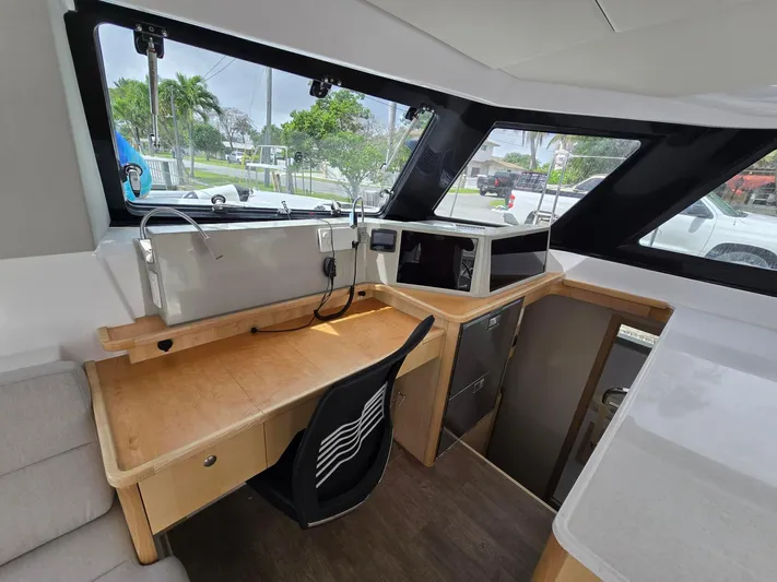  Yacht Photos Pics Interior of 2025 Seawind 1370 yacht with modern navigation station and large windows.