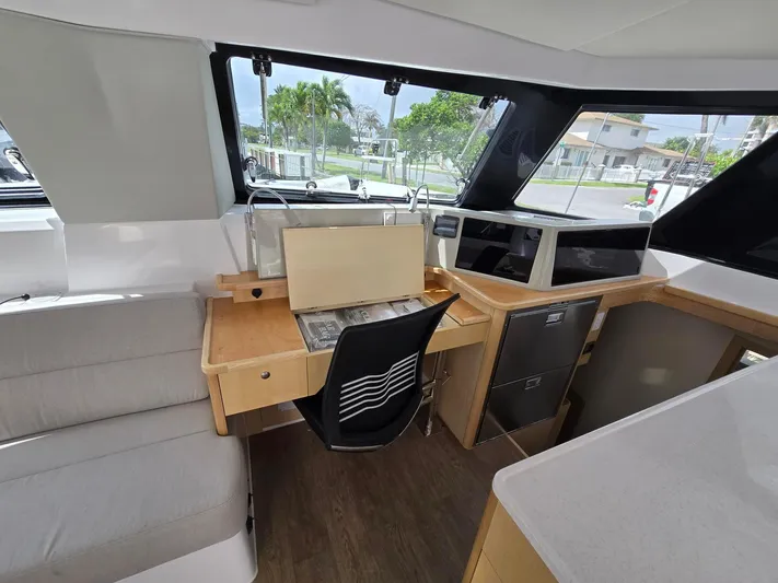  Yacht Photos Pics Interior of 2025 Seawind 1370 yacht with modern navigation station and seating area.