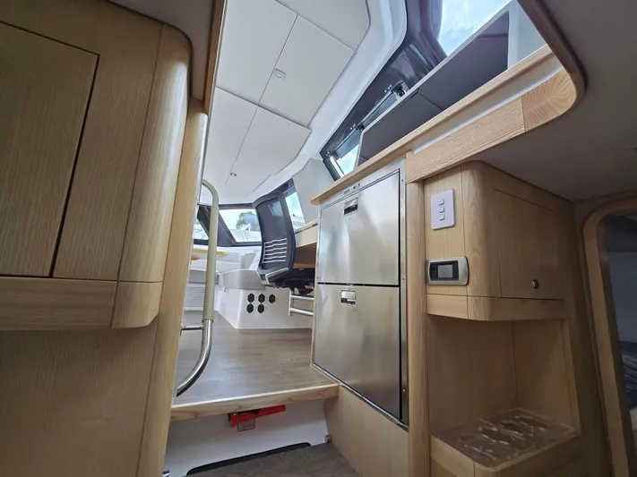  Yacht Photos Pics Interior of 2025 Seawind 1370 yacht, featuring modern kitchen and seating area.