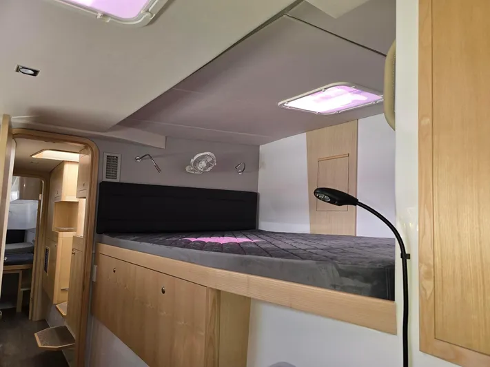  Yacht Photos Pics Interior of 2025 Seawind 1370 yacht with modern sleeping area and ambient lighting.