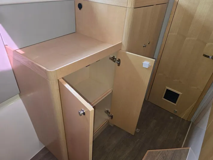  Yacht Photos Pics Interior storage cabinets on a 2025 Seawind 1370 yacht, featuring light wood finish.