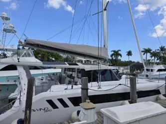  Yacht Photos Pics 2025 Seawind 1370 catamaran docked at marina under clear blue sky.