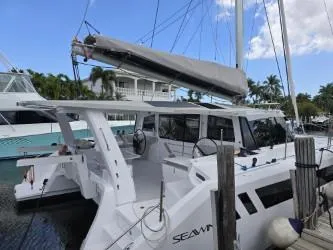  Yacht Photos Pics 2025 Seawind 1370 catamaran docked, featuring sleek design and spacious deck.