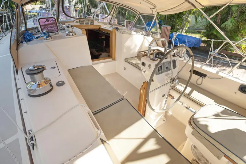 Mawe Yacht Photos Pics Cockpit of 2006 Island Packet 440 sailboat with steering wheel and navigation instruments.