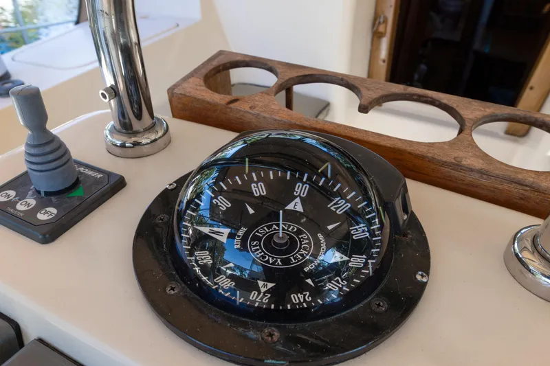 Mawe Yacht Photos Pics Compass and controls on a 2006 Island Packet 440 sailboat.