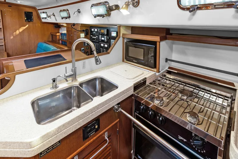 Mawe Yacht Photos Pics 2006 Island Packet 440 yacht kitchen with dual sink, stove, and microwave.