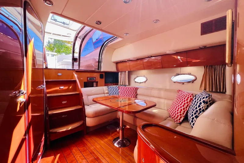  Yacht Photos Pics Luxurious interior of 2007 Windy Typhoon 43 yacht with elegant seating and wooden finishes.