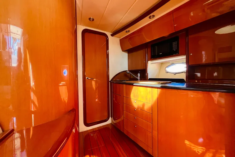  Yacht Photos Pics Luxurious 2007 Windy Typhoon 43 yacht interior with polished wood cabinetry and modern amenities.
