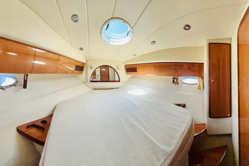  Yacht Photos Pics Luxurious cabin interior of 2007 Windy Typhoon 43 yacht with elegant wood finishes.