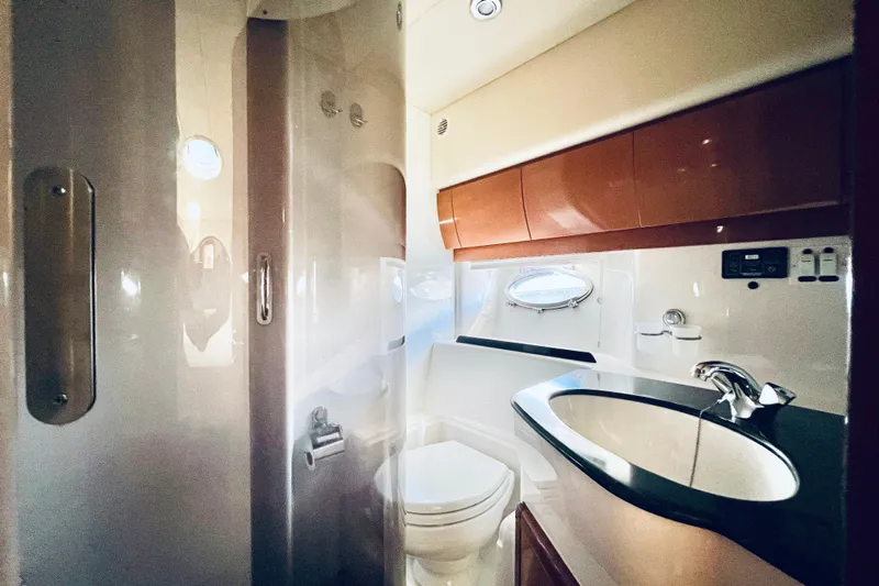  Yacht Photos Pics Luxurious bathroom in 2007 Windy Typhoon 43 yacht with modern fixtures and porthole window.