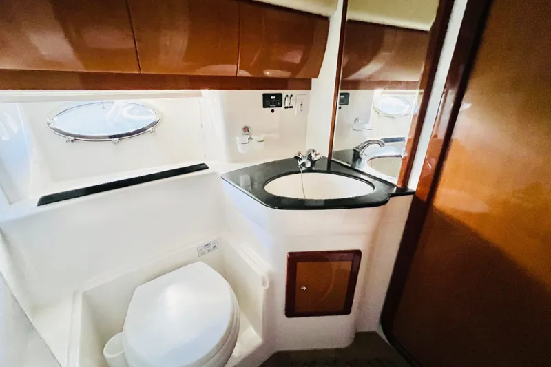  Yacht Photos Pics Luxurious bathroom in 2007 Windy Typhoon 43 yacht with modern fixtures and porthole window.