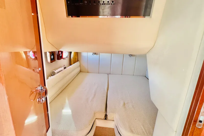  Yacht Photos Pics Cozy cabin interior of 2007 Windy Typhoon 43 yacht with twin beds and soft lighting.