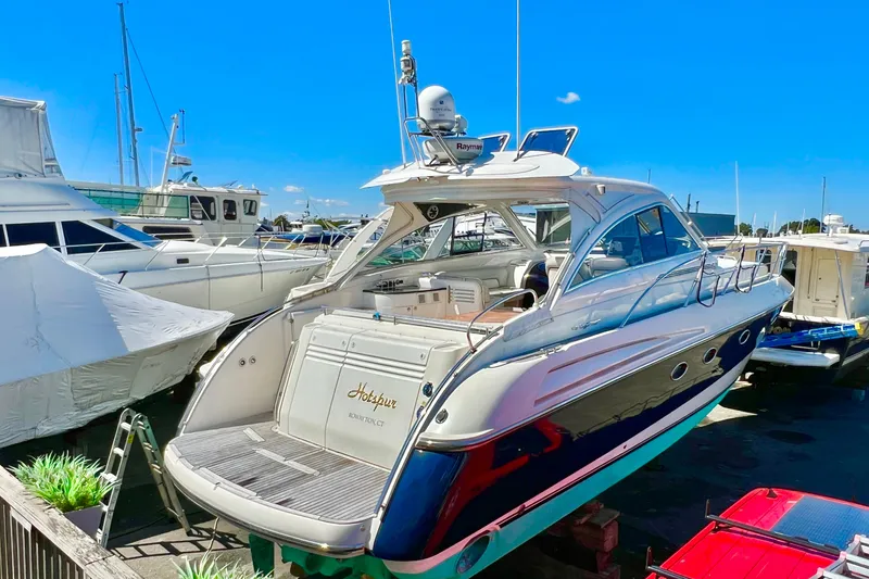  Yacht Photos Pics 2007 Windy Typhoon 43 yacht docked under clear blue sky.