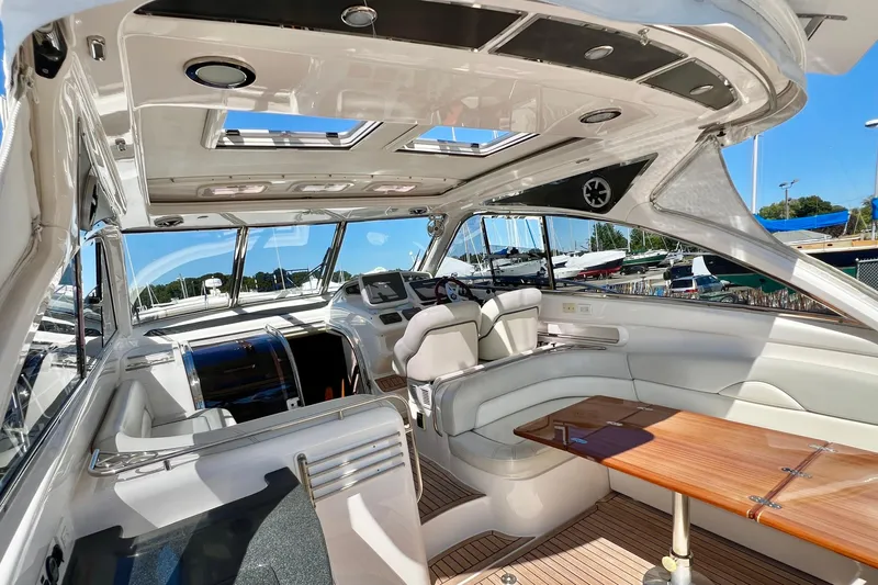  Yacht Photos Pics Luxurious interior of 2007 Windy Typhoon 43 yacht with elegant seating and wooden table.
