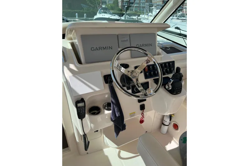 Between Wakes Yacht Photos Pics Helm of 2020 Grady-White Express 330 with Garmin navigation system and controls.