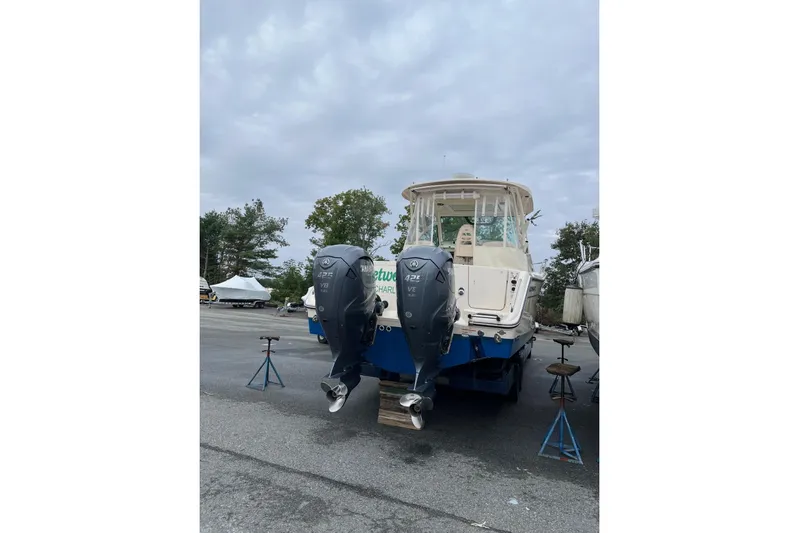 Between Wakes Yacht Photos Pics 2020 Grady-White Express 330 boat with dual outboard engines on a trailer.
