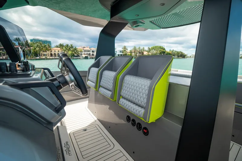 Mako Yacht Photos Pics Interior of 2024 Maori 46ft boat with modern seating and steering wheel.