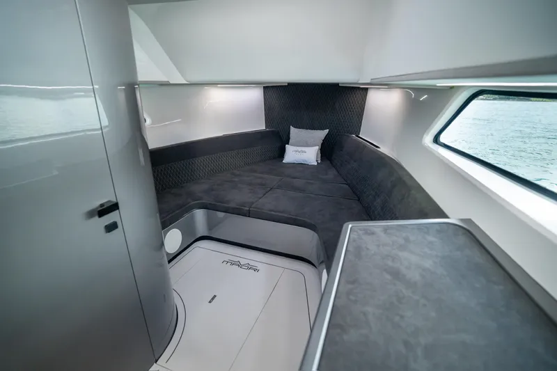 Mako Yacht Photos Pics Luxurious interior of 2024 Maori 46ft yacht with modern seating and window view.