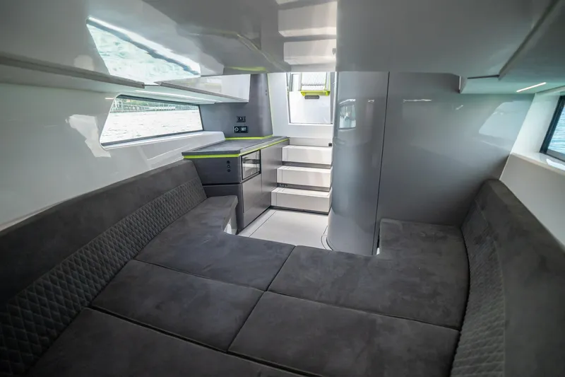 Mako Yacht Photos Pics Luxurious interior of 2024 Maori 46ft yacht with modern seating and sleek design.