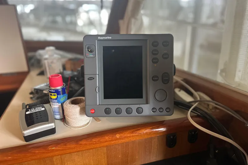 Phoenix Yacht Photos Pics Raymarine navigation system on Island Gypsy 36, 2000 model, with tools and supplies nearby.