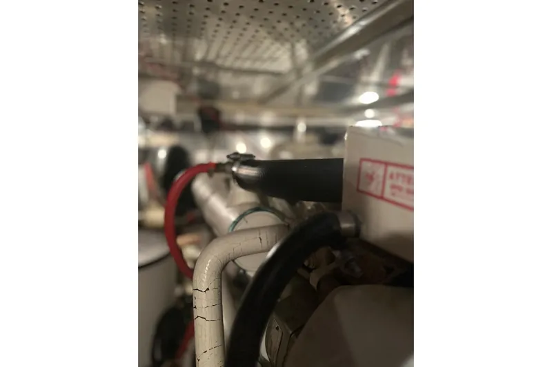 Phoenix Yacht Photos Pics Engine room of 2000 Island Gypsy 36 with visible wiring and components.