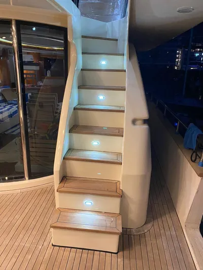  Yacht Photos Pics Staircase on 1998 Azimut 85 Ultimate yacht with illuminated steps and wooden flooring.