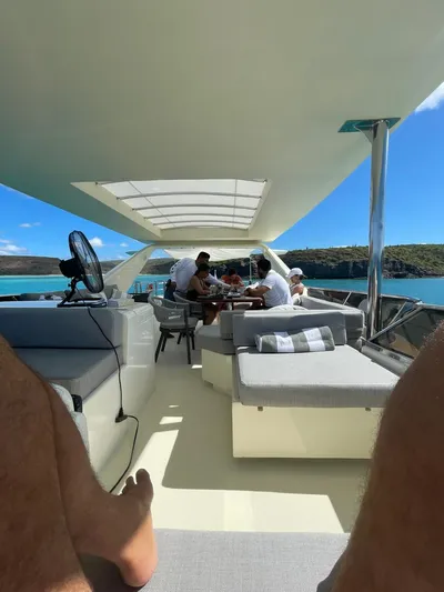  Yacht Photos Pics People relaxing on a 1998 Azimut 85 Ultimate yacht, enjoying a sunny day.