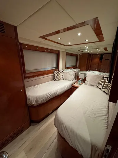  Yacht Photos Pics Luxurious cabin interior of 1998 Azimut 85 Ultimate yacht with twin beds and elegant wood finish.